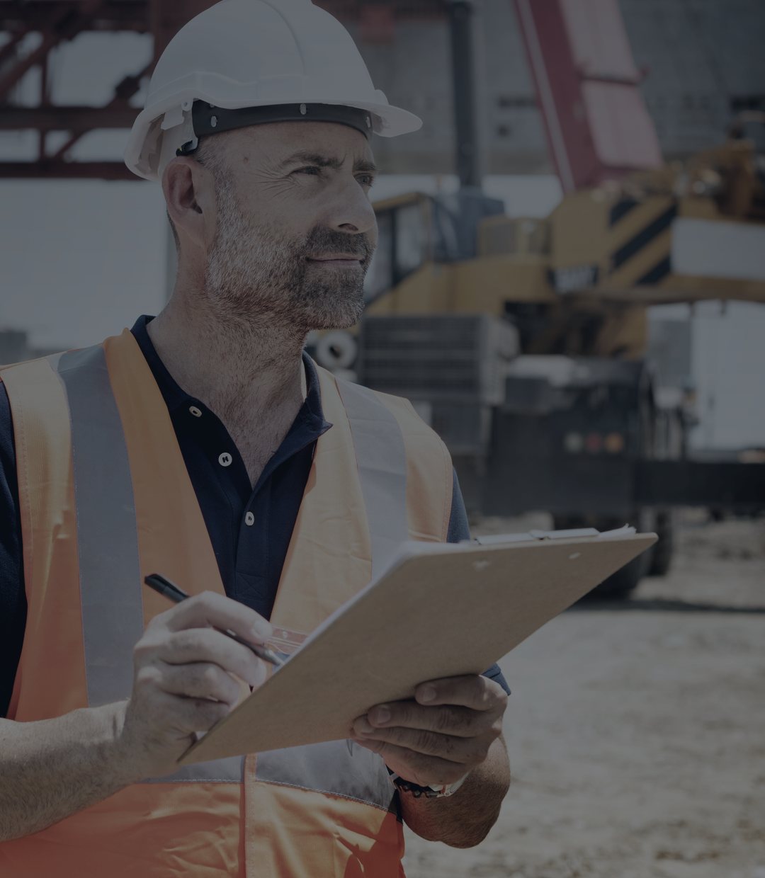 A contractor on an active job site reviewing work